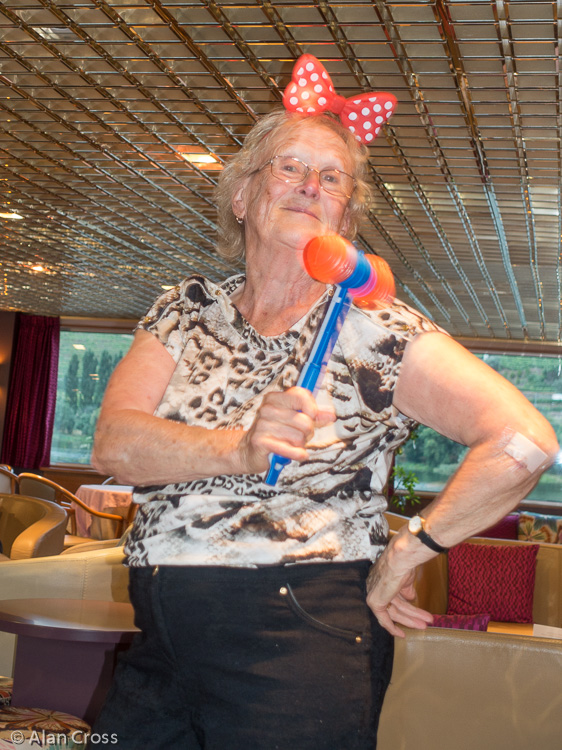 Elaine in party mood, complete with plastic hammer!