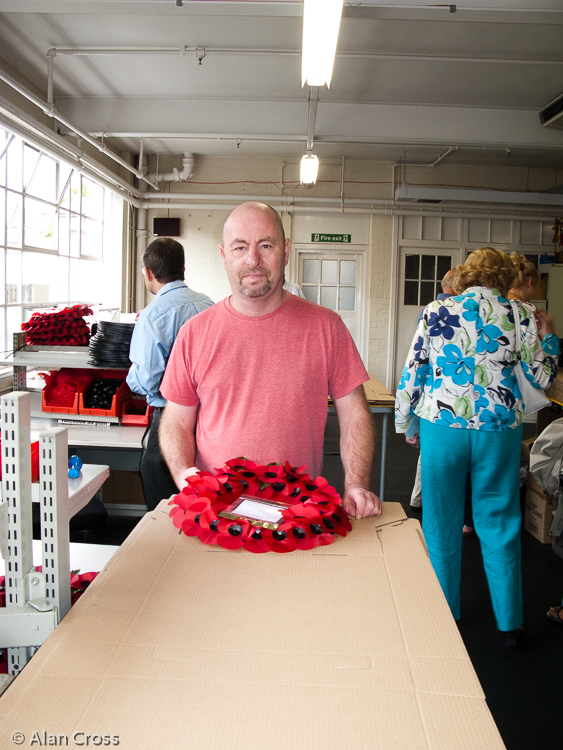 In the poppy and wreath assembly room: Tony packing wreaths