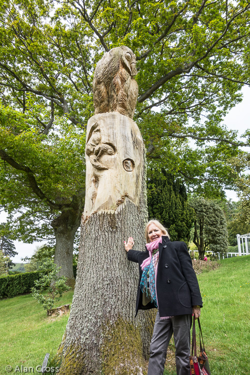 In the Formal Garden: Eileen with carved owl