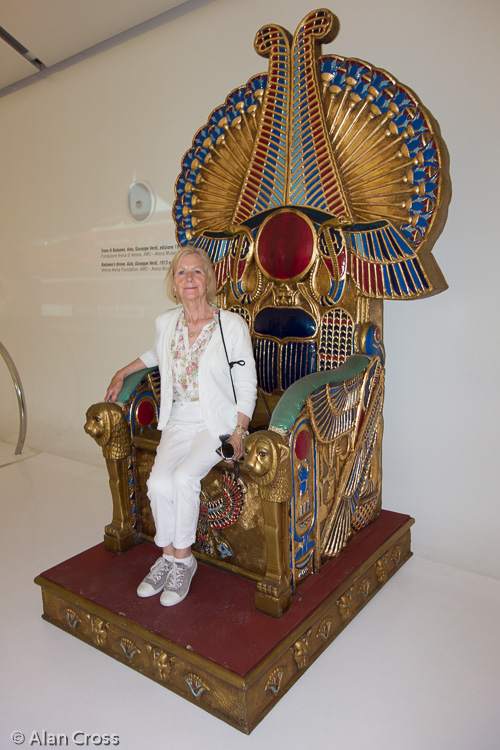 Modena, the Ferrari Museum. Eileen sitting on Radamès' throne (not really allowed!)
