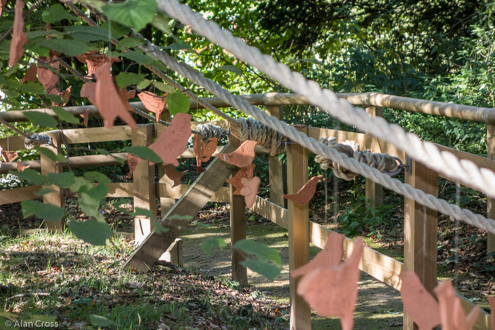 In the grounds of Limnerslease house and studio - terracotta 'mobiles' on the trees outside