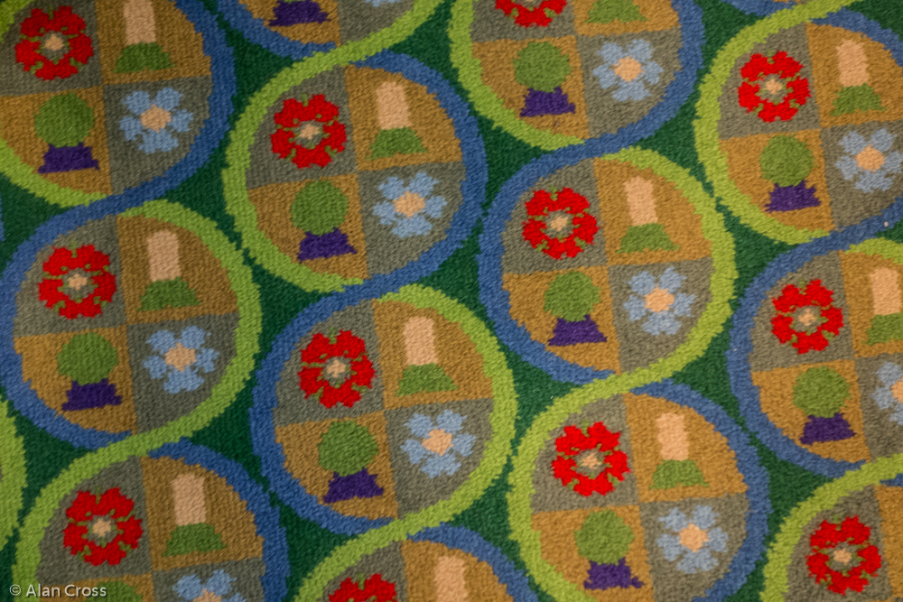 The 'pop art' carpet, alluding to the Court's crest, used throughout the building