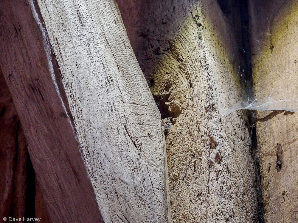 Marks on the wooden beam by the carpenters to show this beam would be the third along that section of the barn