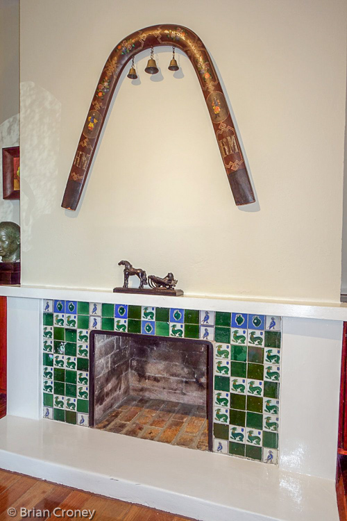 Dining room fireplace with decorative troika harness above