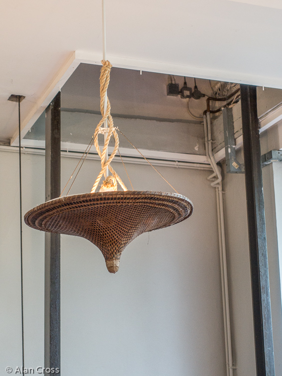 The studio: lampshade fashioned from a Chinese rice-worker's hat