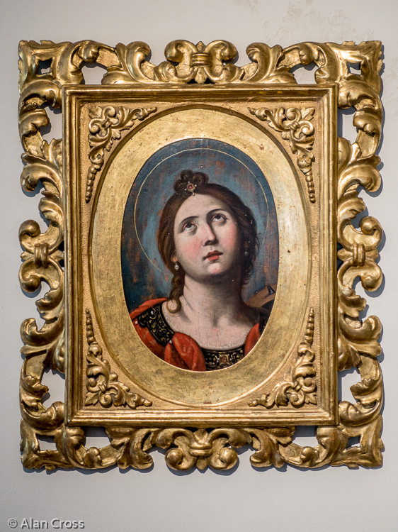 Saint Catherine of Alexandria (her fateful Catherine wheel in the background)