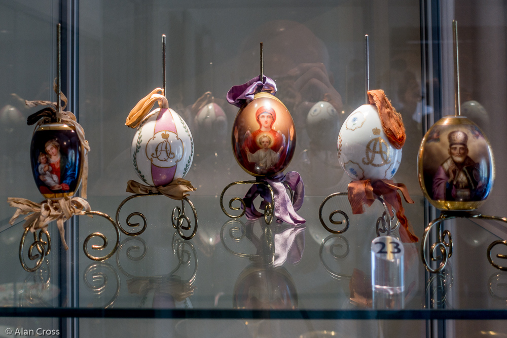 Collection of Russian Easter eggs, including an Imperial Porcelain Factory egg with a painted panel of the Virgin and Child
