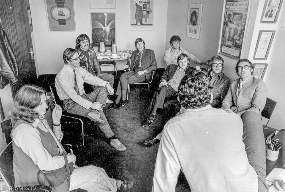 Current Affairs, Features & Documentaries Dept staff in Jeremy Isaacs Office 1973/4. Meg ? later Sawford, Chris Rowley, Jolyon Wimhurst, Ian Martin, Arnold Bulka, Udi Eichler, Andy Andrews, John Edwards – TTV Copyright “No charge for reproduction in newspaper and/or magazines for programme or personality publicity if Thames TV credited”