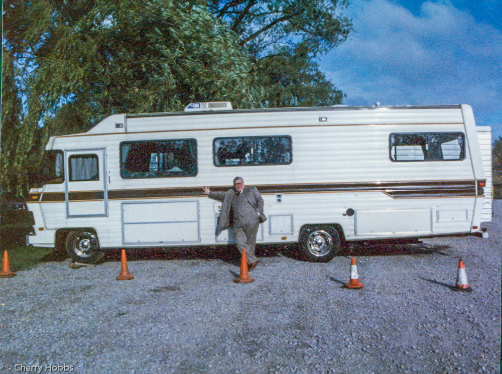 Richard Griffiths posing by Makeup/Wardrobe bus