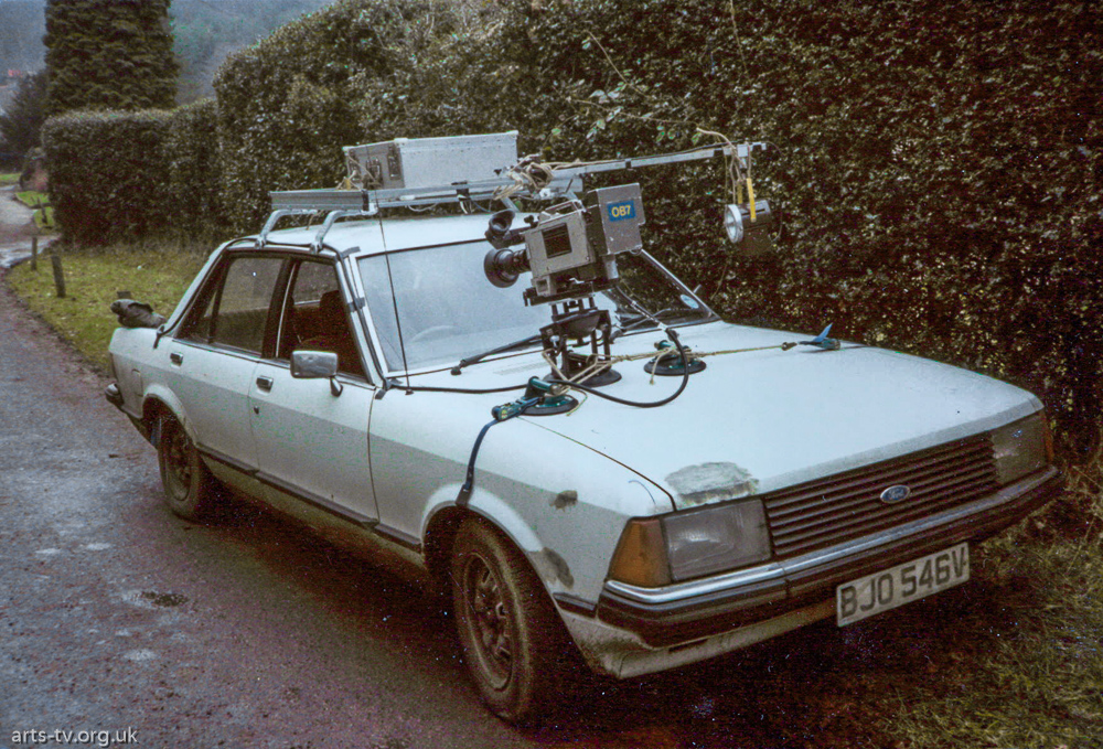 Camera mounted on front of white car – OB7